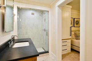 a bathroom with a sink and a shower at Academy Place | Paintbrush in Crested Butte +63 photos