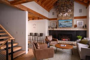 a living room with a couch and a fireplace at Academy Place | Bluebell in Crested Butte