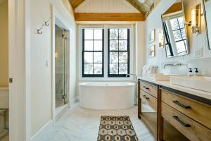 a bathroom with a tub and a sink at Academy Place | Bluebell in Crested Butte +47 photos