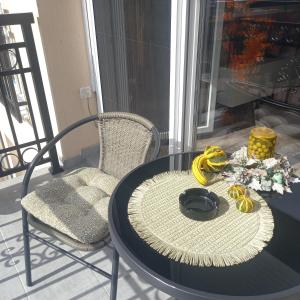 a table and a chair with a banana on it at Apartman Prodan in Sombor