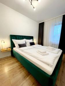 Postel nebo postele na pokoji v ubytování Apartament near RedBull Ring