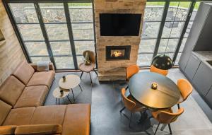 an overhead view of a living room with a table and a fireplace at 2 Bedroom Cozy Home In Kruså in Kruså