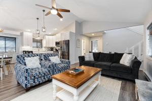 a living room with a couch and a table at Bull City Bungalow with Wintergreen Advantage in Wintergreen