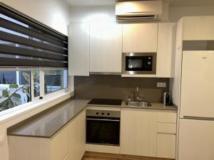 Kuchyň nebo kuchyňský kout v ubytování Apartahotel Baldiri