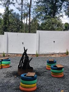 a group of colorful tires sitting on the ground at goosberry poolvilla in Wayanad +1 photo
