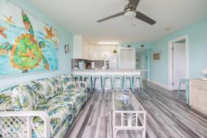 a living room with a couch and a kitchen at Paradise Palms Ocean Pointe 1206 in Key Largo +77 photos