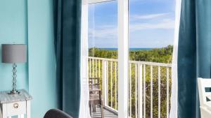 a room with a window with a view of the ocean at Boho Chic Ocean Pointe 3214 in Key Largo
