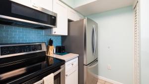 Kuchyň nebo kuchyňský kout v ubytování Aqua Vista Ocean Pointe 3307 + 47 fotografií