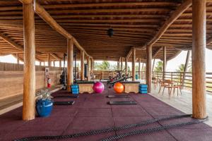 a gym with yoga mats on the floor of a building at Filho do Vento Kite & Lodge in Canguaretama