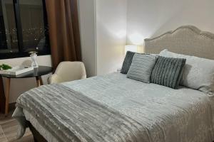 Postel nebo postele na pokoji v ubytování Distrito Artemisa Loft Apartments