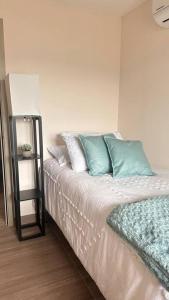 Postel nebo postele na pokoji v ubytování Distrito Artemisa Loft Apartments
