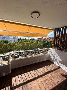 a balcony with a view of a parking lot at Apartamento los jazmines in Roquetas de Mar