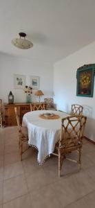 a dining room with a table and two chairs at Apartamento Neptuno in Benagil