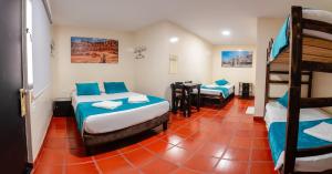 Postel nebo postele na pokoji v ubytování Hotel Villa Paraiso + 33 fotografií