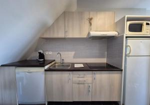 Kuchyň nebo kuchyňský kout v ubytování Appartement Vue Mer