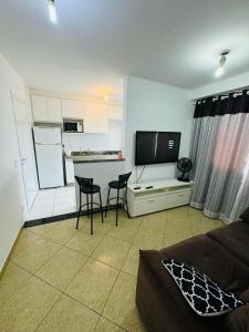 a living room with a couch and a table and chairs at Aeroporto de Guarulhos 2 in Guarulhos +13 photos