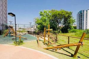 a playground with a slide in a park at Aeroporto de Guarulhos 2 in Guarulhos