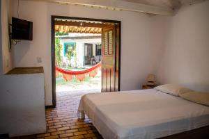 Ένα ή περισσότερα κρεβάτια σε δωμάτιο στο Mansão do Sol +26 φωτογραφίες