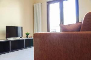 TV a/nebo společenská místnost v ubytování Calefati Holiday 412