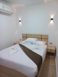 Postel nebo postele na pokoji v ubytování Malak Guest House + 37 fotografií