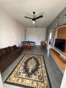 a living room with a couch and a table at Ape Vista Mar in Guarapari