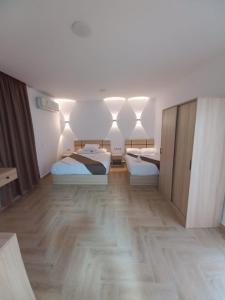 Postel nebo postele na pokoji v ubytování Malak Guest House