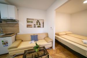 Postel nebo postele na pokoji v ubytování Four Seasons Apartments