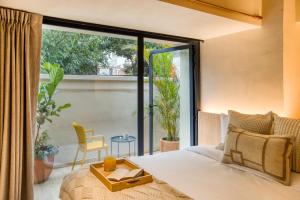 Postel nebo postele na pokoji v ubytování Caliza Roma Residences by Tasman