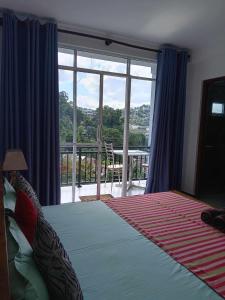 Postel nebo postele na pokoji v ubytování Cozy Homestay Kandy