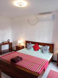 Postel nebo postele na pokoji v ubytování Cozy Homestay Kandy