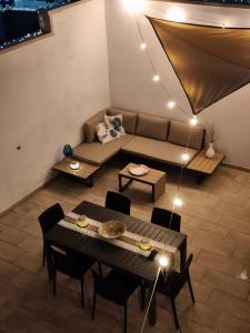 a living room with a couch and a table at Casa Vacanza Japigia in Leuca