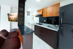 Piso en el Quindío, apartamento de lujo的厨房或小厨房