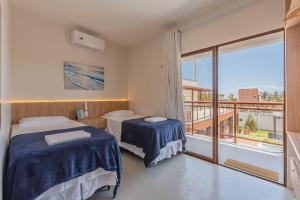Ένα ή περισσότερα κρεβάτια σε δωμάτιο στο Casa Guerreiro - Elegância no Cumbuco by Carpediem