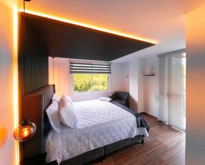Piso en el Quindío, apartamento de lujo客房内的一张或多张床位