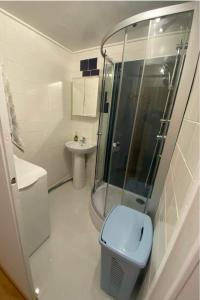 a bathroom with a shower and a toilet and a sink at Feroom in Košice