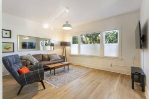a living room with a couch and a table at 2BR Hideaway in the heart of SE Portland in Portland