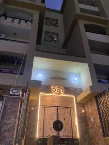 a large entrance to a building with a sign on the door at Cozy House In Gardenia, Nasr city, Center in Cairo