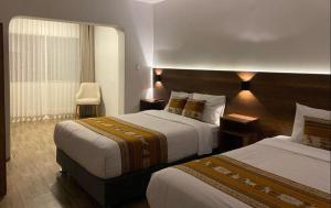 Postel nebo postele na pokoji v ubytování Hotel Rumi