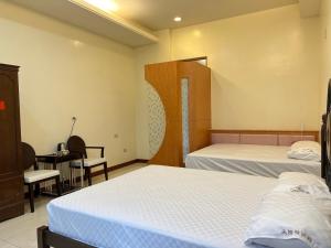 Vuode tai vuoteita majoituspaikassa 天隆民宿Tian Long Tea Farm HomeStay