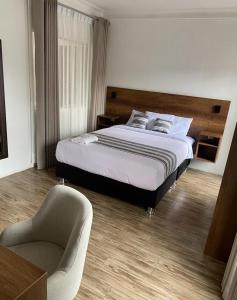 Postel nebo postele na pokoji v ubytování Hotel Rumi