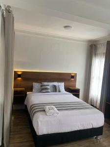 Postel nebo postele na pokoji v ubytování Hotel Rumi