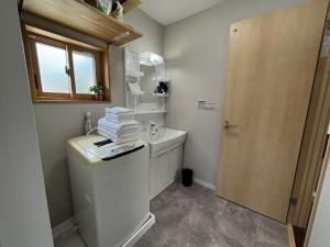 A kitchen or kitchenette at コリーヌ小山