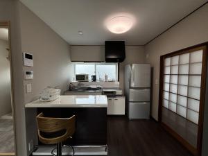 A kitchen or kitchenette at コリーヌ小山 Még 16 kép
