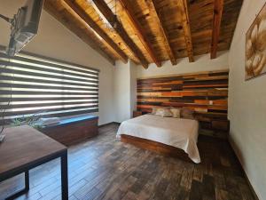 Rúm í herbergi á Cabañas Santorito