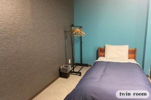 Vuode tai vuoteita majoituspaikassa GUESTHOUSE富士と碧