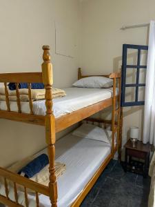 Postel nebo postele na pokoji v ubytování Casa Surya Paraty