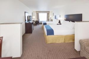 a hotel room with two beds and a television at Holiday Inn Express & Suites - Omaha I - 80, an IHG Hotel in Gretna