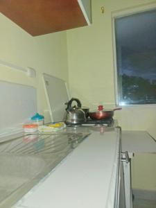 a kitchen with a tea kettle on top of a counter at Hotel in Cuenca