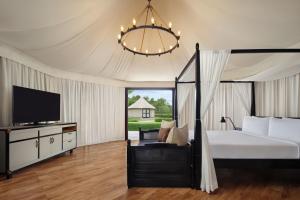 Natra Bintan, a Tribute Portfolio Resort客房内的一张或多张床位