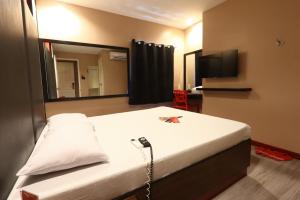 Postel nebo postele na pokoji v ubytování Hotel Sogo San Jose Del Monte, Bulacan